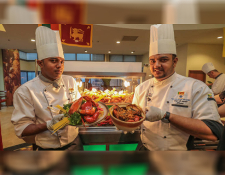 Chefs Hettiarachchi (L) and Jayawardhana with their crab curry dishes. — Sunpix by Amirul Syafiq Mohd Din